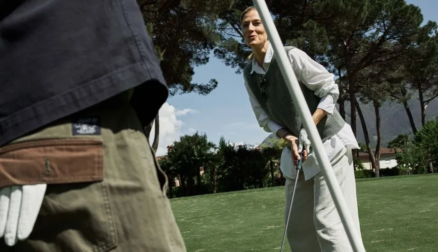 Woman having fun playing golf 1